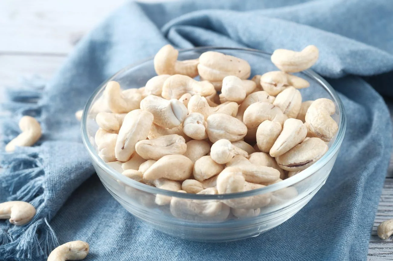 Processed cashew kernels in a glass bowl